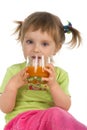 Cute little girl drink carrot juice Royalty Free Stock Photo