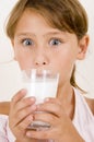 Cute little girl drinking milk Royalty Free Stock Photo