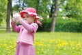 Cute little girl drinking water in park Royalty Free Stock Photo