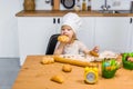 Cute little girl eat tasty pastry, fresh baking buns and cookies