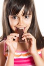 Cute little girl eating chocolate Royalty Free Stock Photo