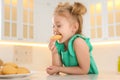 Cute little girl eating cookies Royalty Free Stock Photo