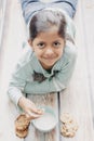 Cute little girl eating cookies with milk Royalty Free Stock Photo