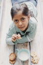 Cute little girl eating cookies with milk Royalty Free Stock Photo