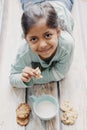 Cute little girl eating cookies with milk Royalty Free Stock Photo