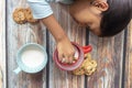 Cute little girl eating cookies with milk Royalty Free Stock Photo