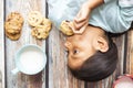 Cute little girl eating cookies with milk Royalty Free Stock Photo