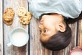 Cute little girl eating cookies with milk Royalty Free Stock Photo