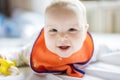 Cute little girl eating fruit with nibbler and smiling Royalty Free Stock Photo