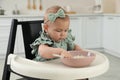 Cute little girl eating healthy food at home Royalty Free Stock Photo