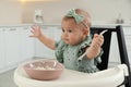 Cute little girl eating healthy food at home Royalty Free Stock Photo