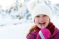 Cute little girl while eating icicle on beautiful winter day Royalty Free Stock Photo