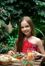 Cute little girl is eating  salad Royalty Free Stock Photo