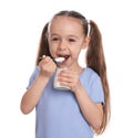 Cute little girl eating tasty yogurt on background Royalty Free Stock Photo