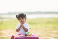 Cute Little girl enjoy playing play doh at park Royalty Free Stock Photo