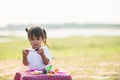 Cute Little girl enjoy playing play doh at park Royalty Free Stock Photo