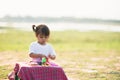 Cute Little girl enjoy playing play doh at park Royalty Free Stock Photo