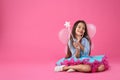 Cute little girl in fairy costume with wings and magic wand on pink background. Space for text Royalty Free Stock Photo