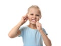 Cute little girl flossing teeth on white background Royalty Free Stock Photo