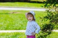 Cute little girl gets dandelion and smiling, happy family having fun playing outdoor, summer nature Royalty Free Stock Photo