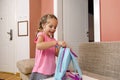 Cute little girl getting ready for preschool