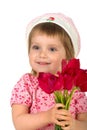 Cute little girl giving pink tulips