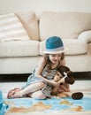 Cute little girl going on family vacation, studying map. Royalty Free Stock Photo