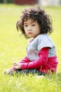 Cute little girl on the grass Royalty Free Stock Photo
