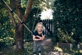 Cute little girl hanging on a tree swing outside Royalty Free Stock Photo