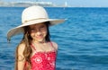 Cute little girl in hat relaxing on the sea, summer, vacation, t