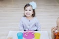 Cute little girl having breakfast with her friend Royalty Free Stock Photo