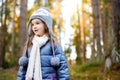 Cute little girl having fun during forest hike on beautiful spring day. Child exploring nature Royalty Free Stock Photo