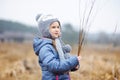 Cute little girl having fun during forest hike on beautiful spring day. Child exploring nature Royalty Free Stock Photo