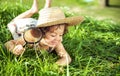 Cute little girl having fun with a magnifer