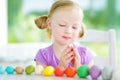 Cute little girl having fun with modeling clay at a daycare. Creative kid molding at home. Royalty Free Stock Photo