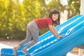 Cute little girl having fun on a playground outdoors in summer Royalty Free Stock Photo