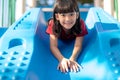 Cute little girl having fun on a playground outdoors in summer Royalty Free Stock Photo