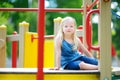 Cute little girl having fun on a playground Royalty Free Stock Photo