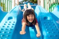 Cute little girl having fun on a playground outdoors in summer Royalty Free Stock Photo