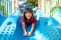 Cute little girl having fun on a playground outdoors in summer Royalty Free Stock Photo