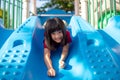 Cute little girl having fun on a playground outdoors in summer Royalty Free Stock Photo