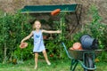 Cute little girl helping her mother in the backyard Royalty Free Stock Photo