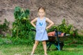 Cute little girl helping her mother in the backyard Royalty Free Stock Photo