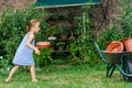 Cute little girl helping her mother in the backyard Royalty Free Stock Photo