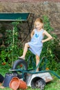 Cute little girl helping her mother in the backyard Royalty Free Stock Photo