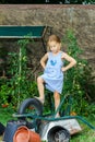 Cute little girl helping her mother in the backyard Royalty Free Stock Photo