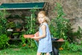 Cute little girl helping her mother in the backyard Royalty Free Stock Photo