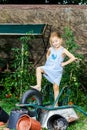 Cute little girl helping her mother in the backyard Royalty Free Stock Photo