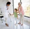 Cute little girl with her grandmother at the pediatrician examination Royalty Free Stock Photo