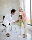 Cute little girl with her grandmother at the pediatrician examination Royalty Free Stock Photo